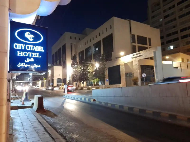The hotel front at night on King Hussein Street